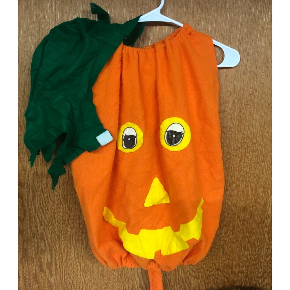 Baby halloween outfit. Pumpkin with hat which has a stem.